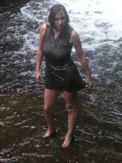 These are really cool pictures, where you’ll see a stunning busty Milf get soaking wet while standing by a waterfall. She is wearing a; Amateur Milf 